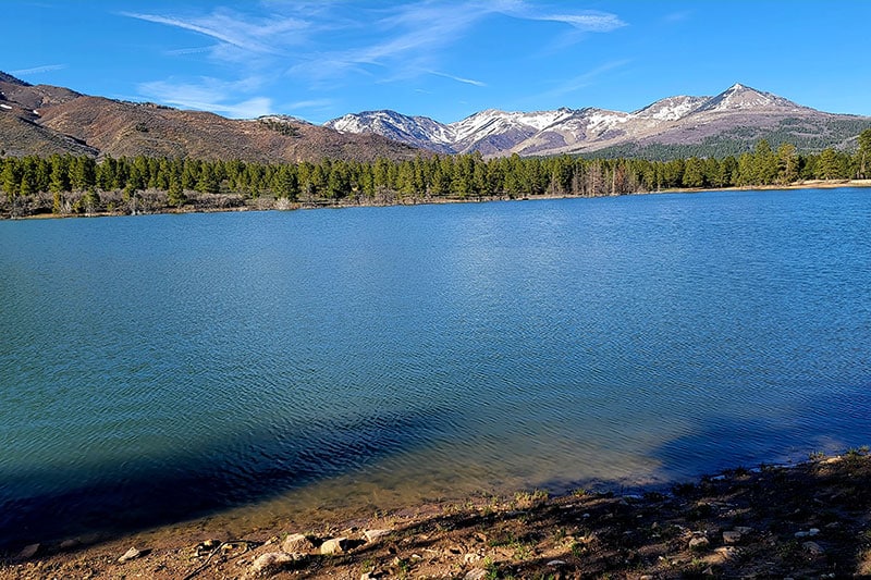 Abajo Mountain Lake with mountains in the background