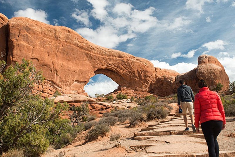 A couple hiking towards Arches National Park